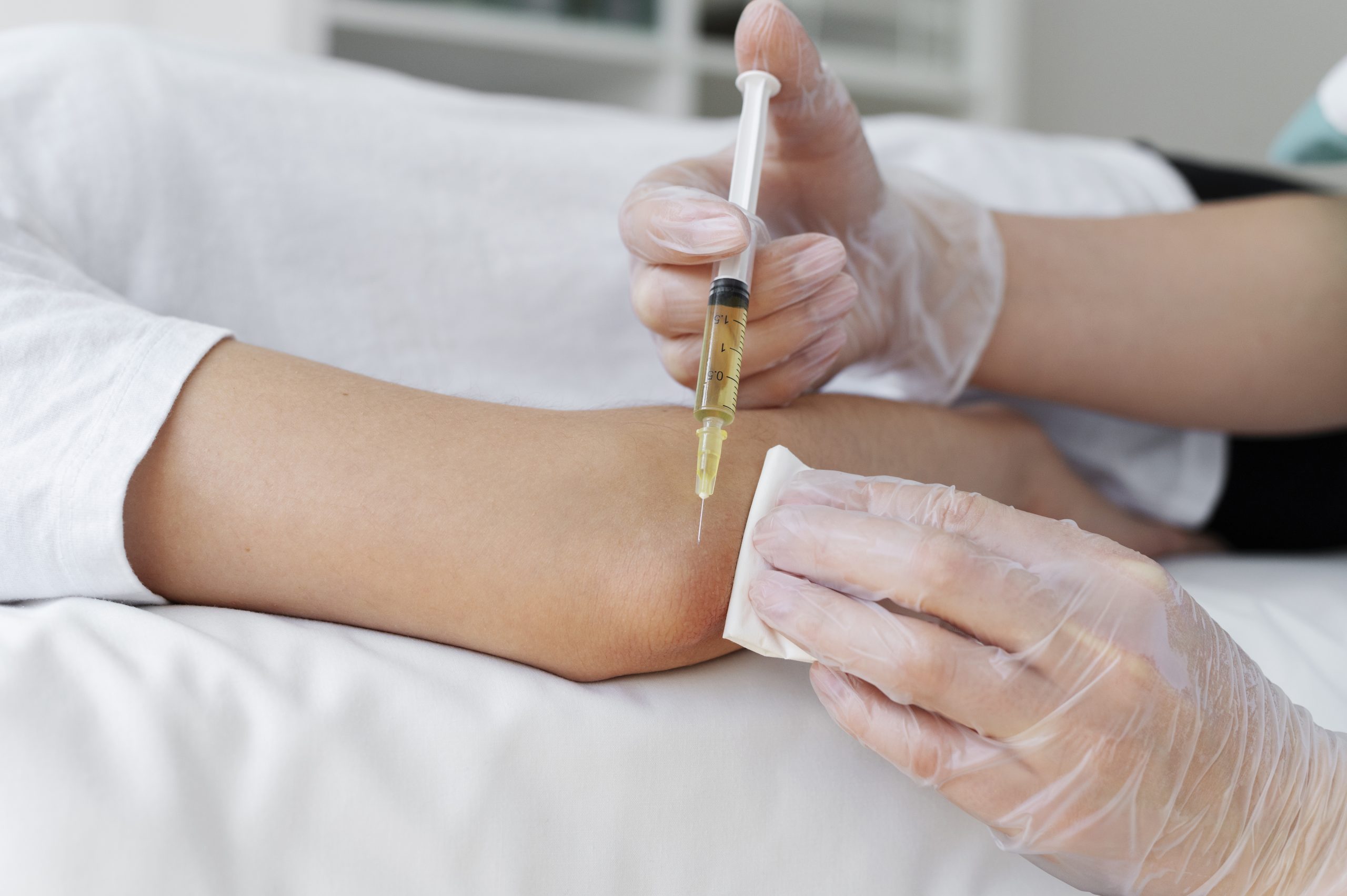Patient receiving an injection during a clinical treatment